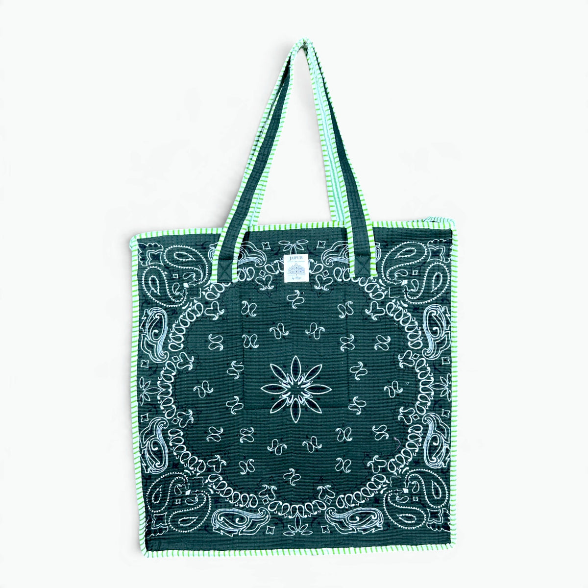 Forest green quilted cotton tote bag with white bandana paisley print and lime green and white striped piping and handles