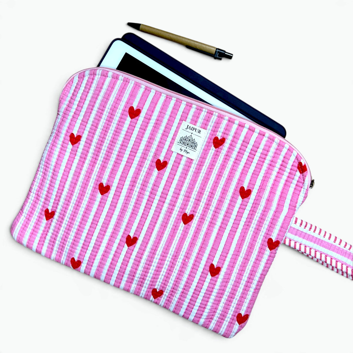 Pink and white striped quilted cotton iPad sleeve with red hearts and striped wrist loop, with a tablet and pen