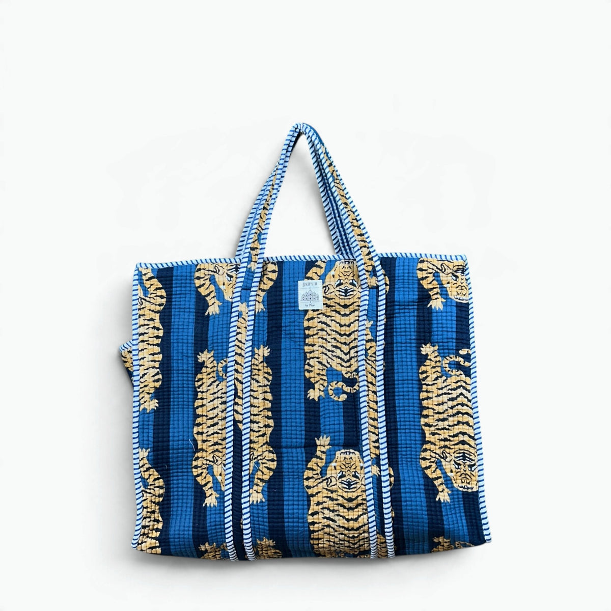 ue and navy striped quilted cotton tote bag with golden tiger print and blue and white striped piping and handles