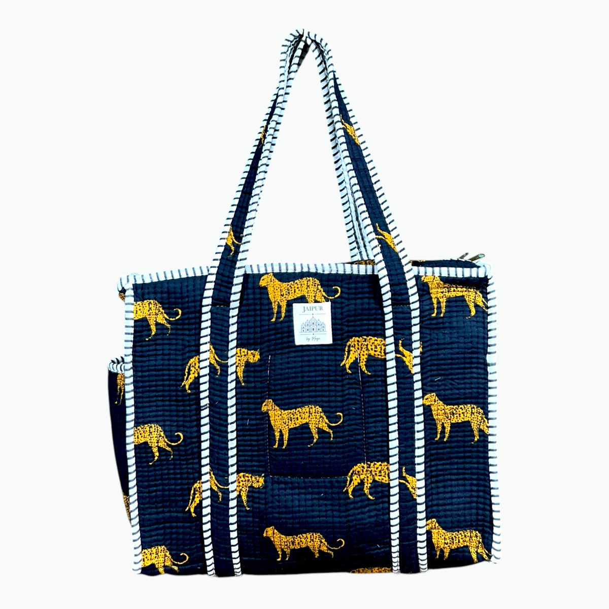 Black quilted cotton zip tote bag with golden leopard print and black and white striped piping and handles