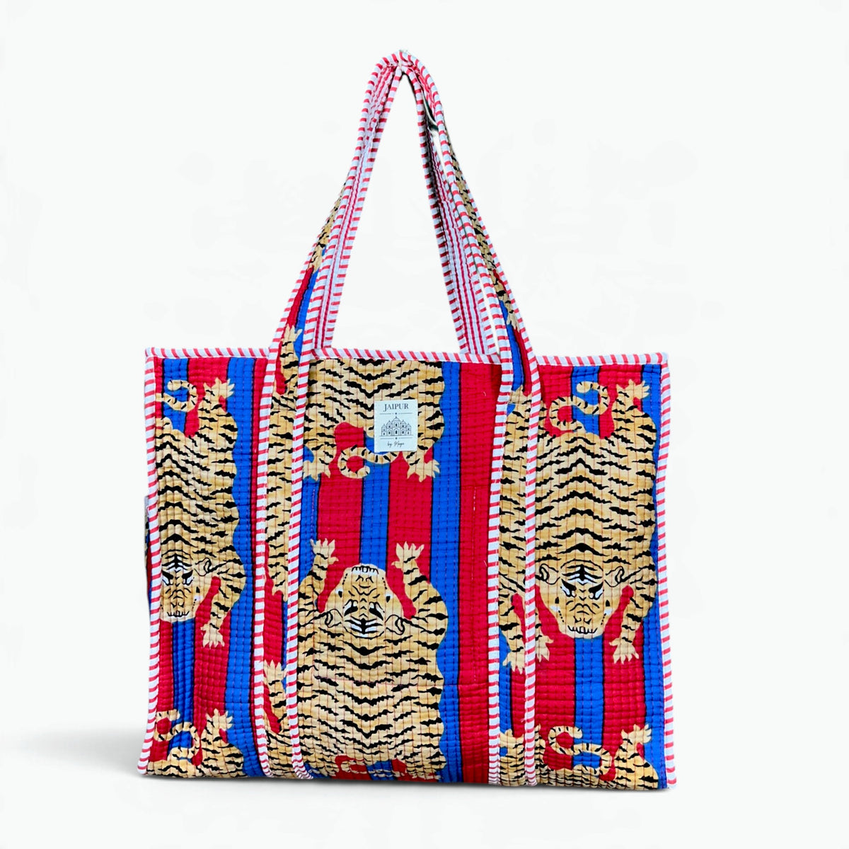 Red and blue striped quilted cotton tote bag with tiger print and red and white striped piping and handles