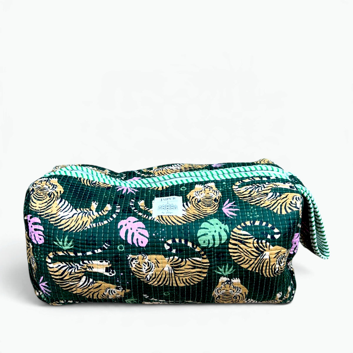 Green quilted cotton travel storage bag with tiger and monstera leaf print and green striped wrist loop for hair styler
