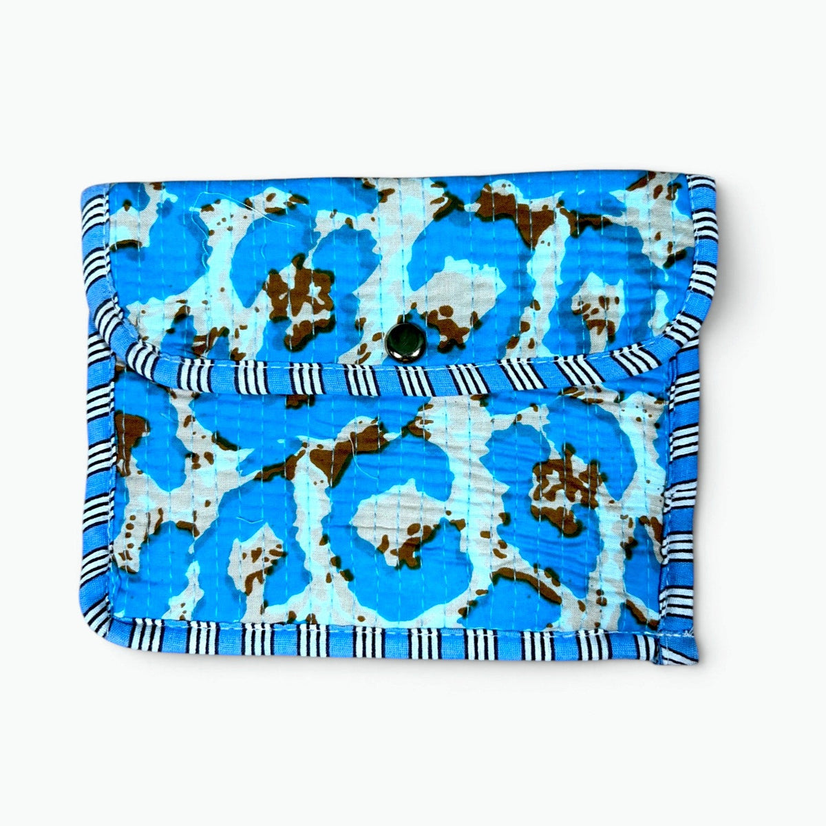 A small fabric pouch or wallet with a blue and white cow print pattern and black-and-white striped trim, shown on a plain white background.