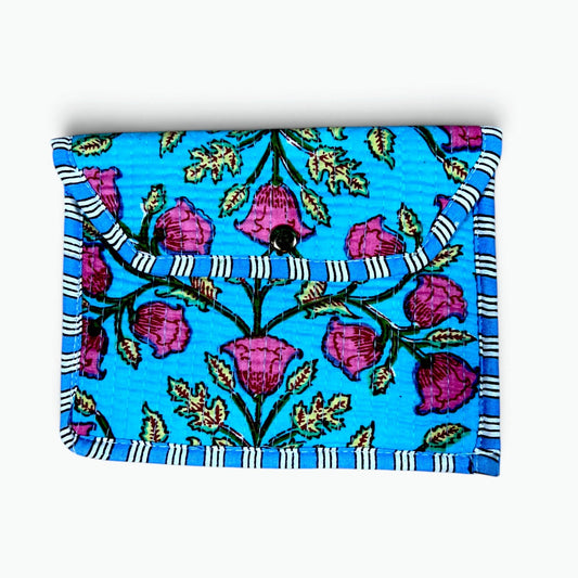 A square fabric pouch or notebook cover featuring a bright blue background with a pink floral vine pattern and striped trim, shown on a clean white background.