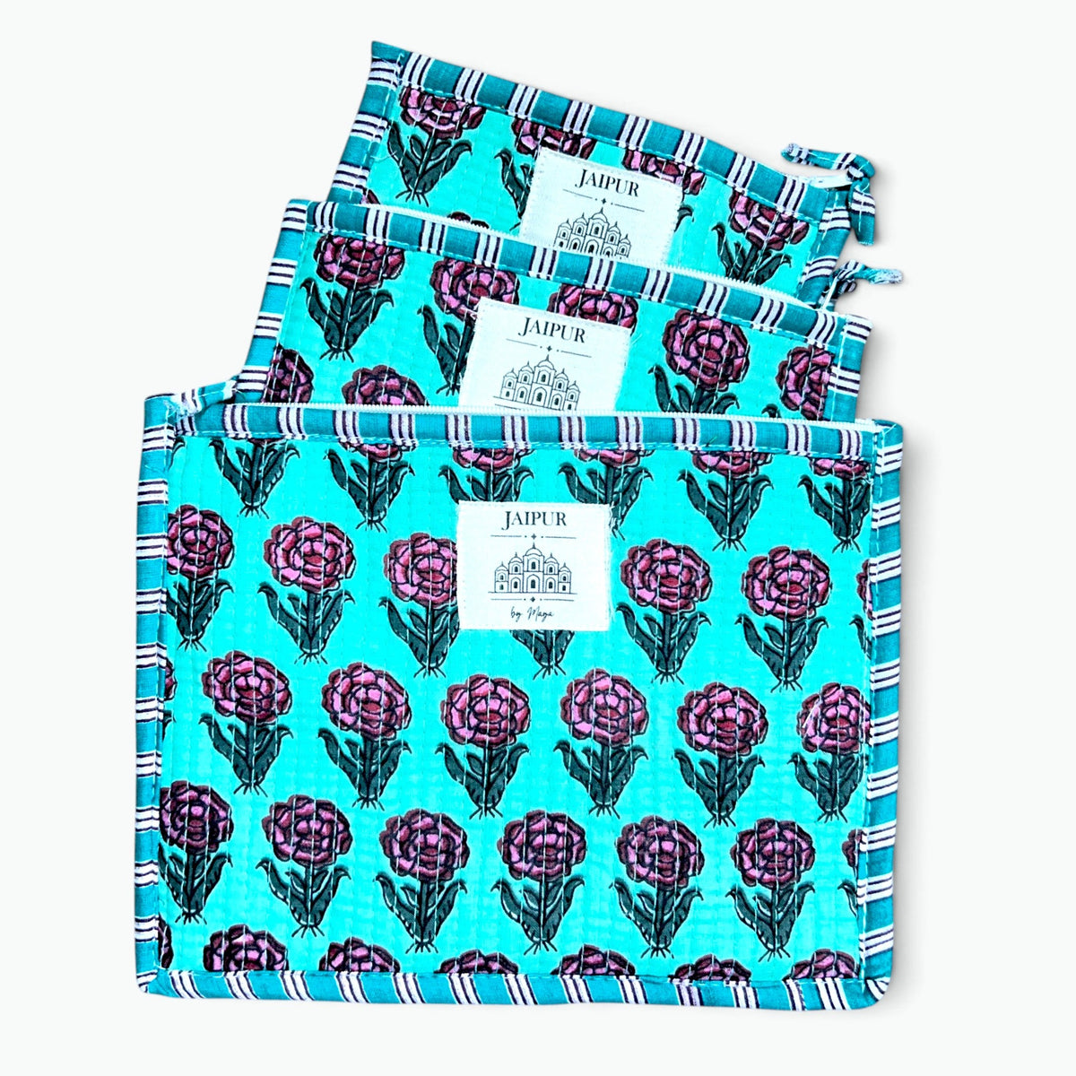 Set of three aqua quilted cotton zip pouches in three sizes with pink rose print and teal striped piping