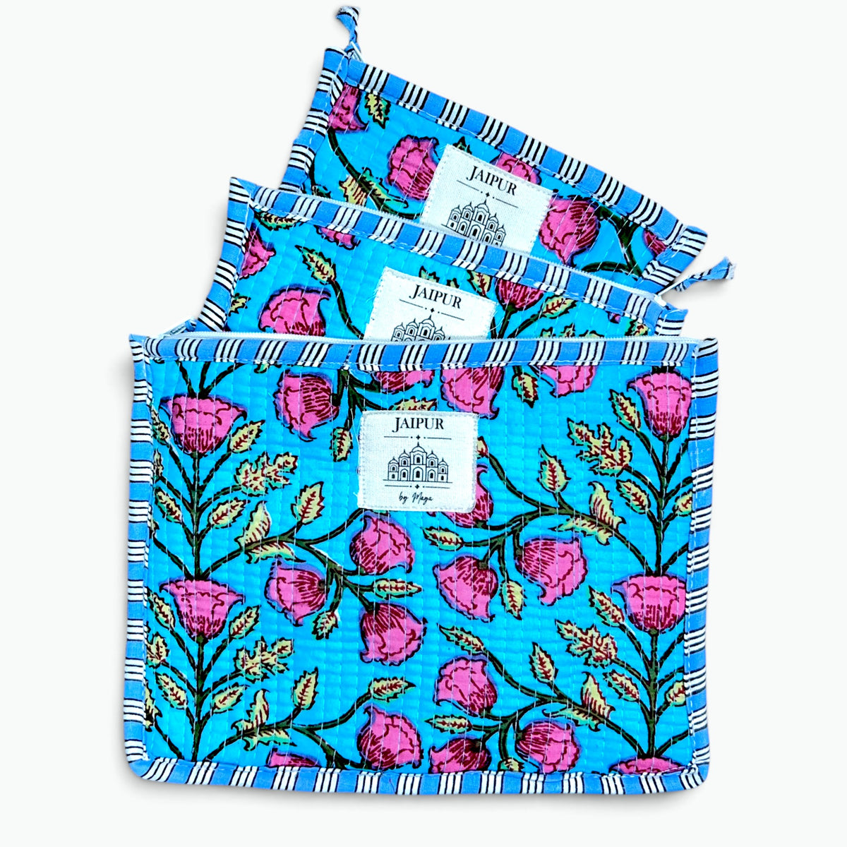 Three square cotton kitchen towels with a vibrant blue background, pink rose pattern, and black-and-white striped borders, displayed on a clean white background.